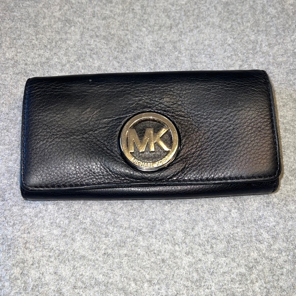 Michael Kors Handbags - Michael kors wallet black with mk gold logo.